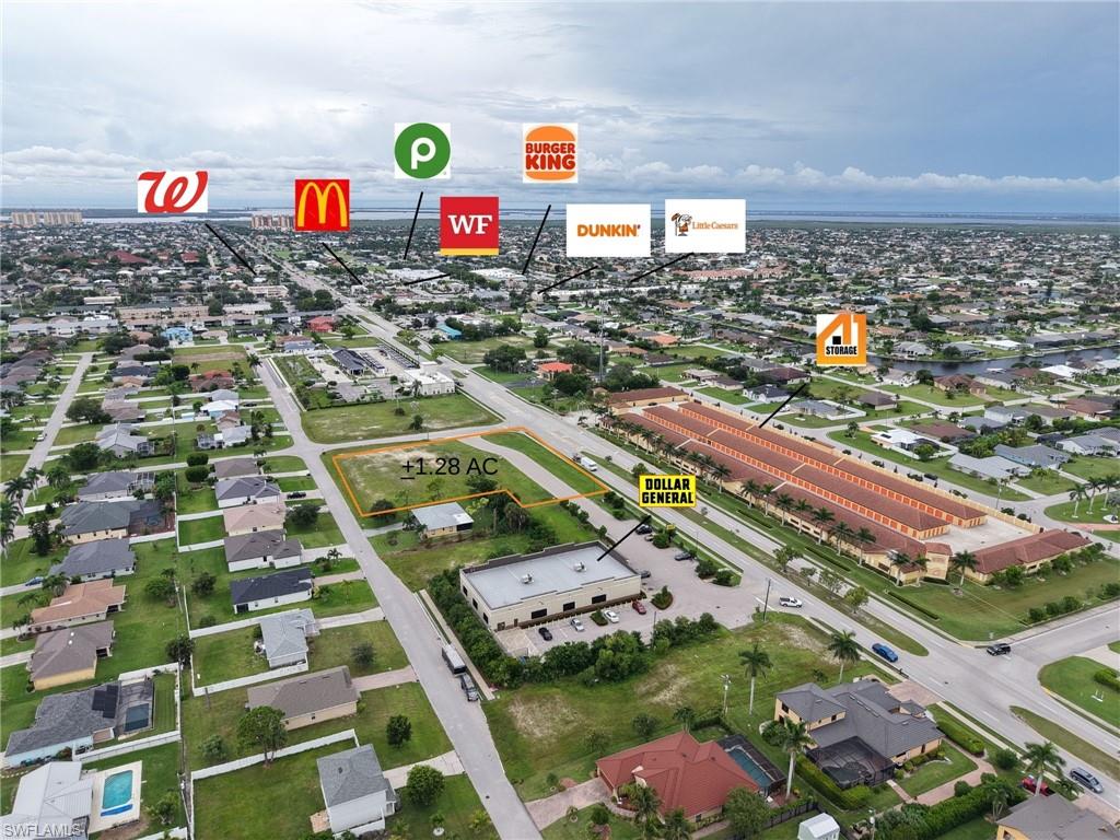 Aerial overview of property's location featuring nearby suburban area