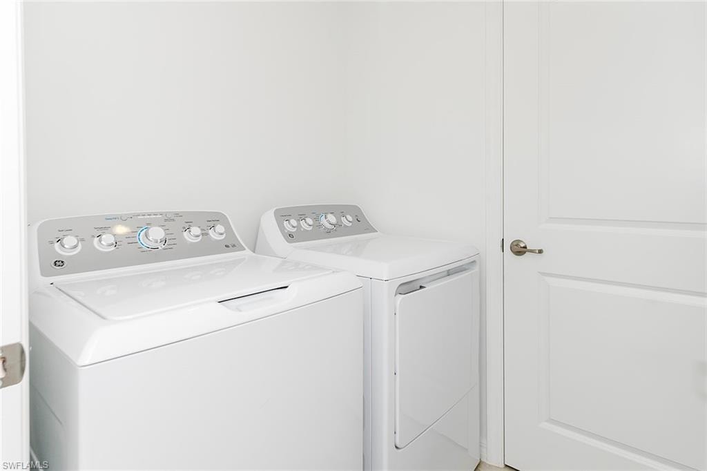 Laundry room with washing machine and dryer
