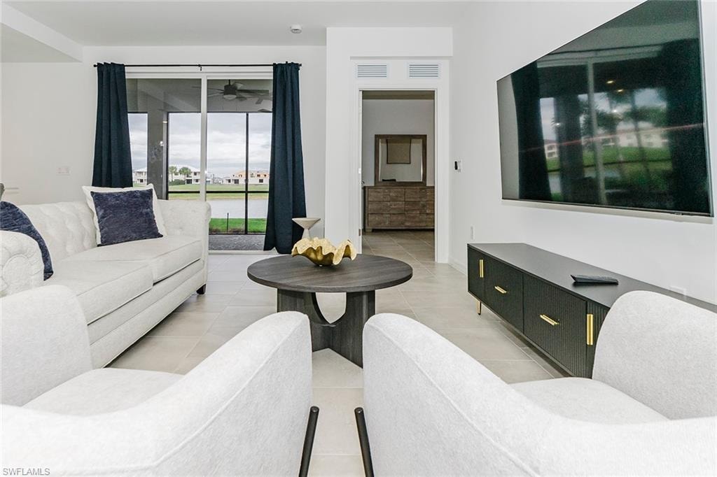 Living area featuring light tile patterned floors