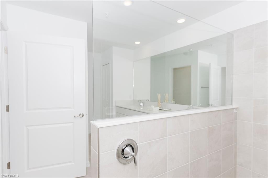 Full bath with double vanity and recessed lighting