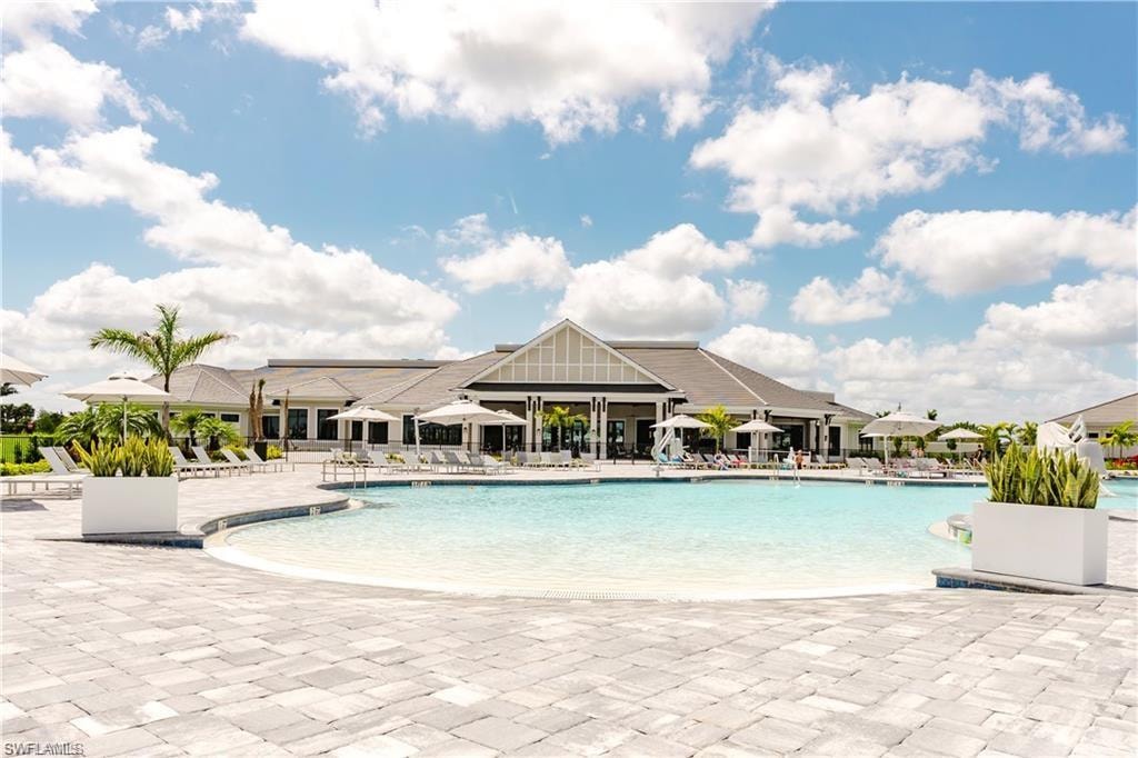 Community pool featuring a patio area