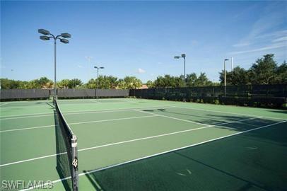 View of tennis court with community basketball court