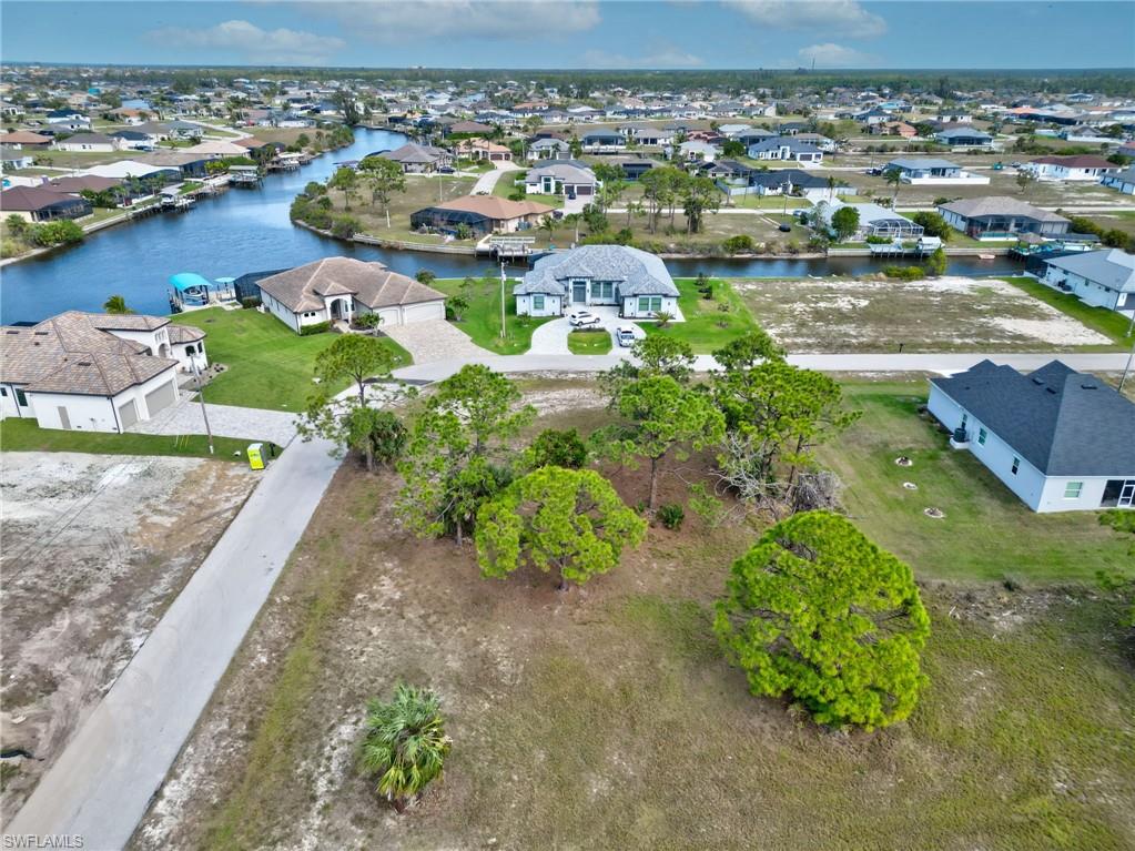 Aerial view of residential area with a nearby body of water