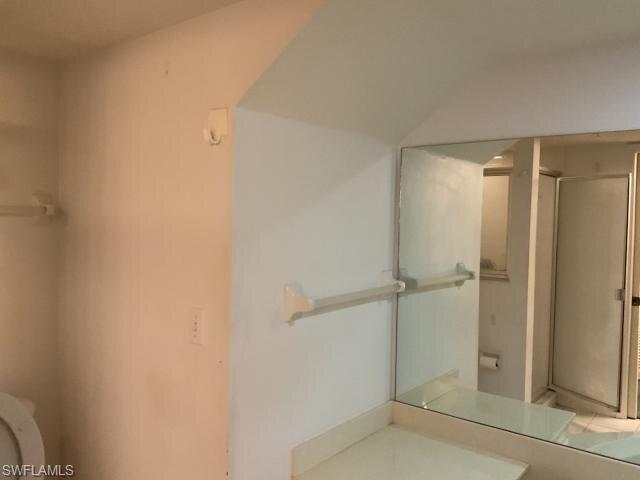 Full bathroom featuring vanity and a stall shower