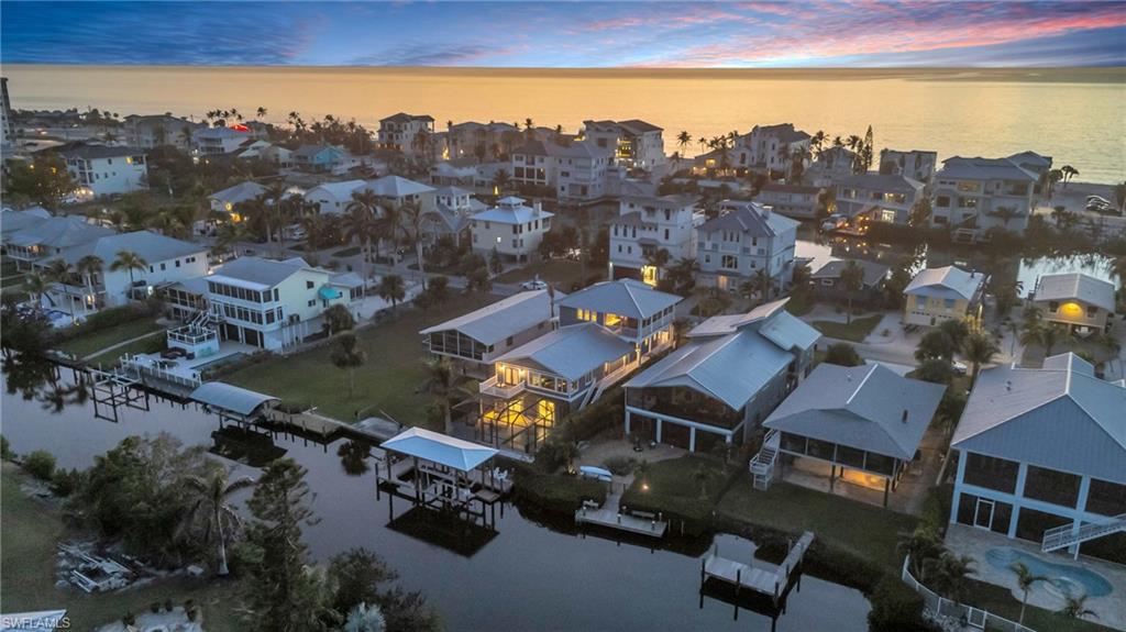 Aerial view of residential area with a large body of water