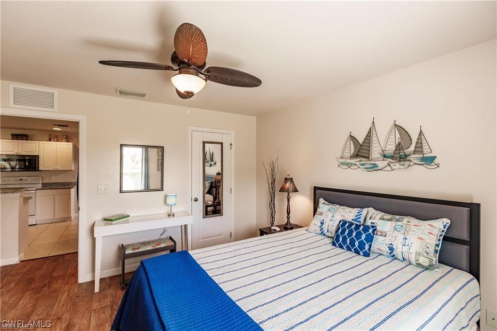 Bedroom featuring wood finished floors and ceiling fan
