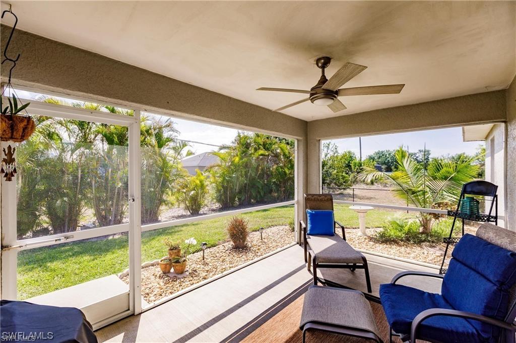 Sunroom featuring plenty of natural light and a ceiling fan