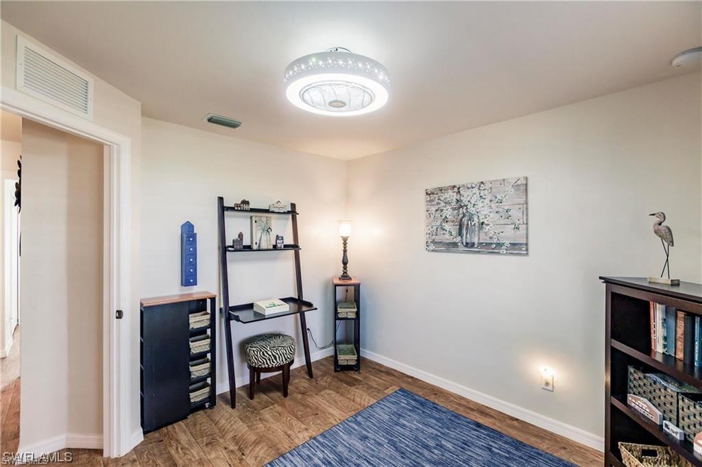 Office featuring wood finished floors and baseboards