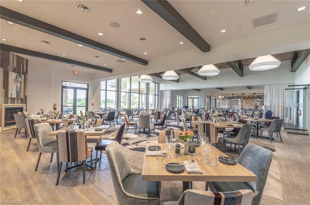 Dining room featuring beamed ceiling and light wood-style floors