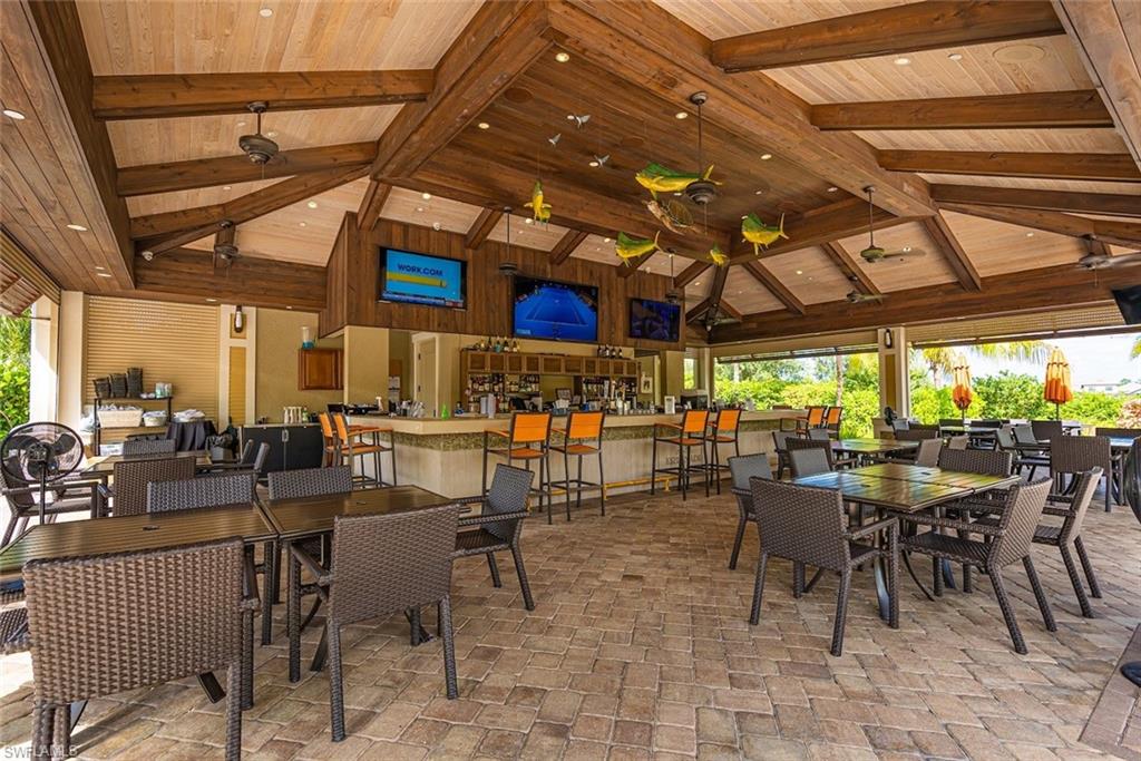 Dining space with high vaulted ceiling, plenty of natural light, and beam ceiling