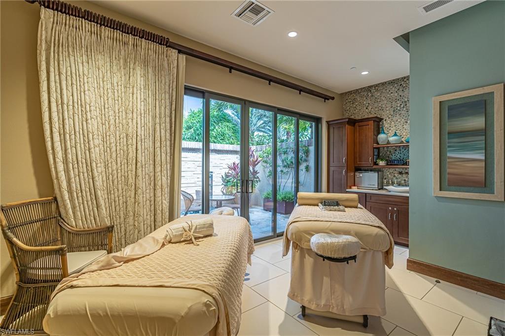 Living area featuring light tile patterned flooring and recessed lighting