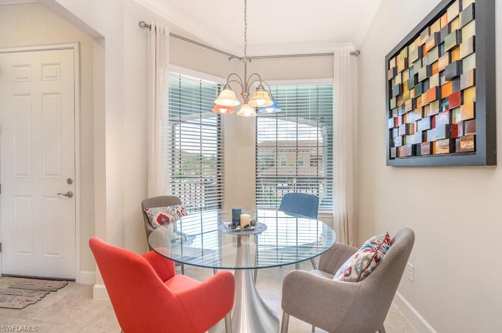 Dining room featuring a chandelier and tile patterned flooring