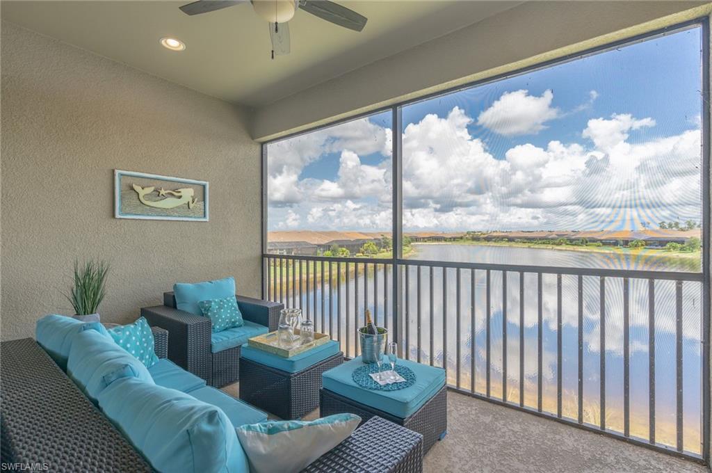 Sunroom featuring a water view