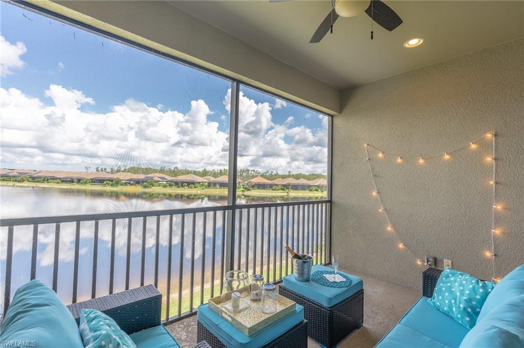 Sunroom featuring a water view