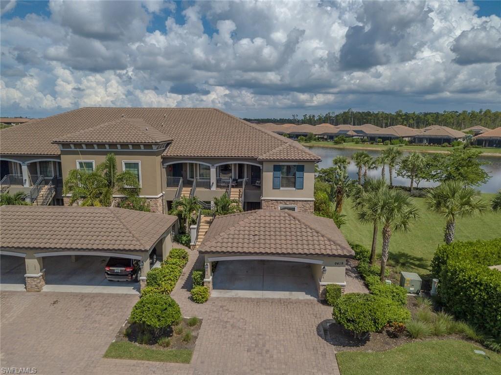 Mediterranean / spanish-style home featuring stone siding, stucco siding, a residential view, and a tile roof