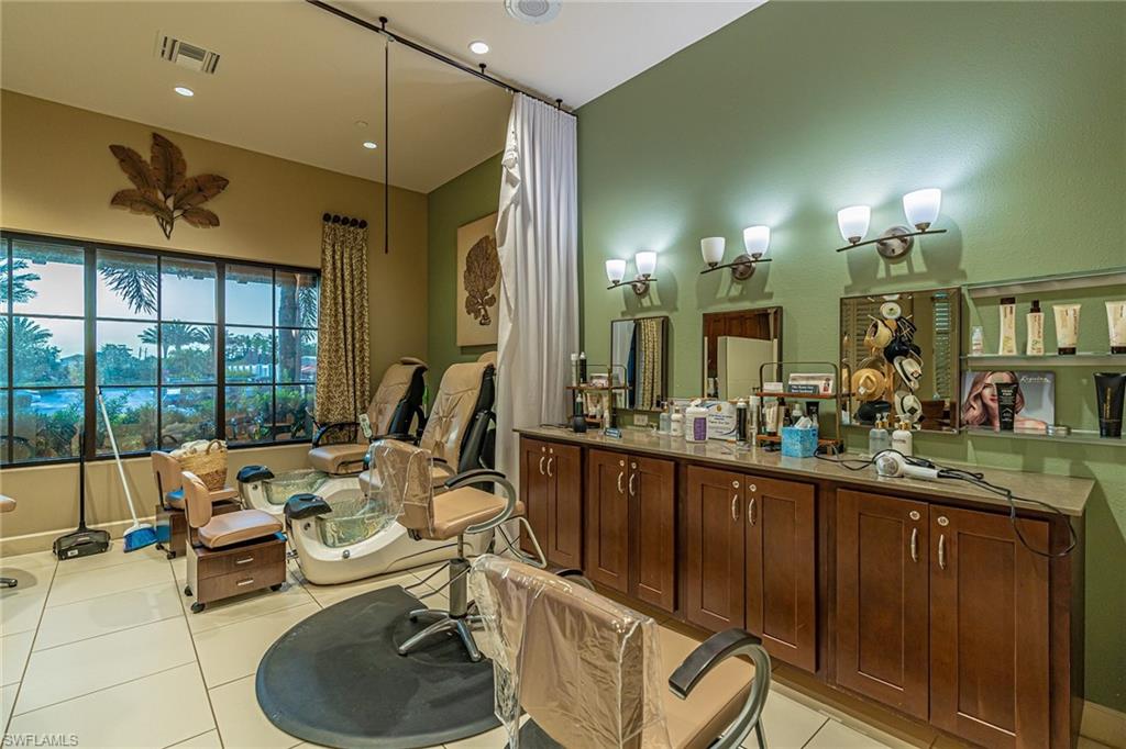 Bathroom with light tile patterned flooring, recessed lighting, and vanity