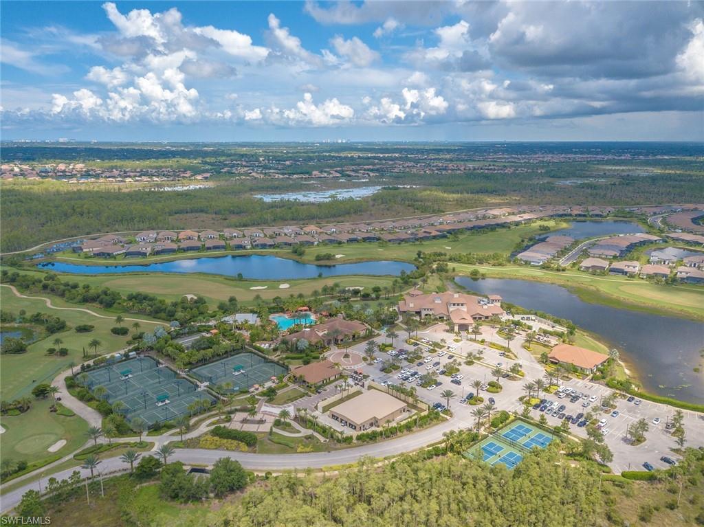 Aerial view of property's location featuring nearby suburban area and a large body of water