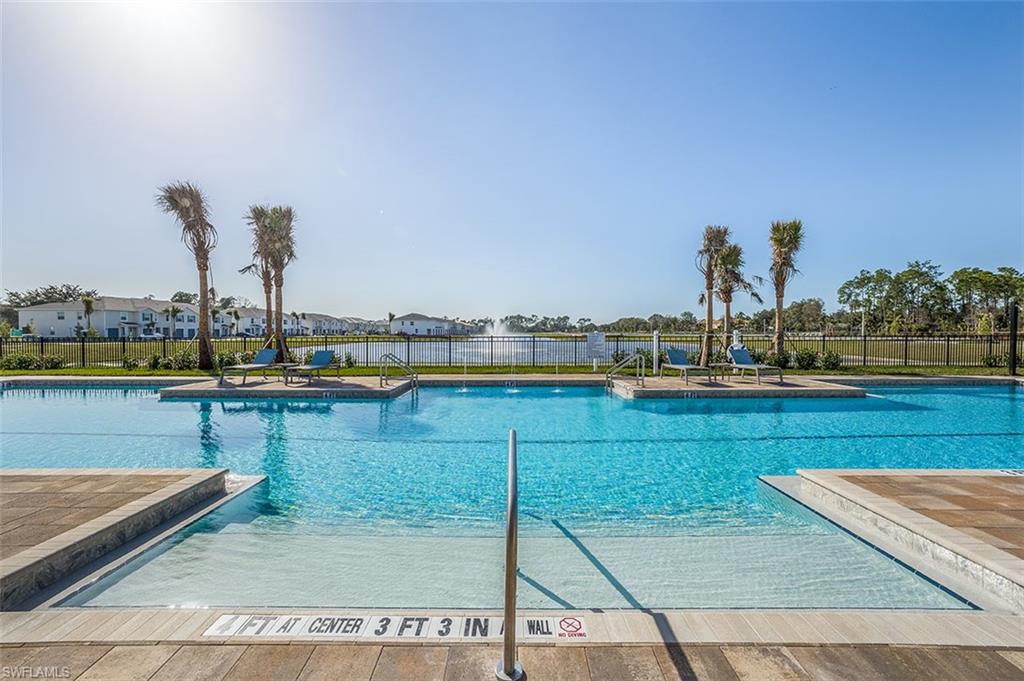 Community pool with a patio area