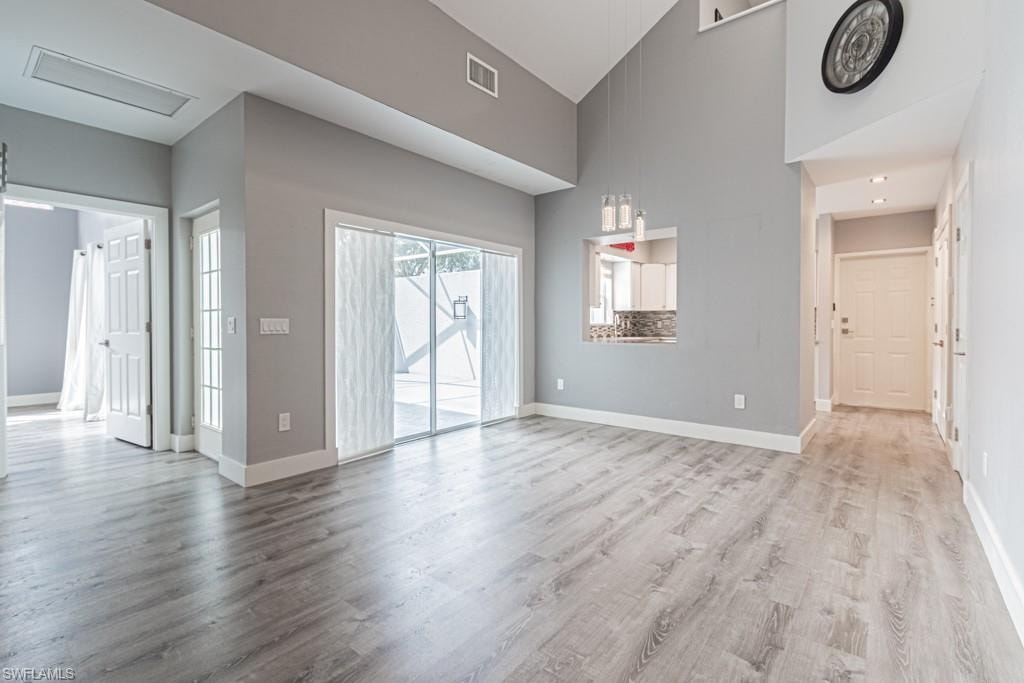 living room with llots of light and vaulted ceiling
