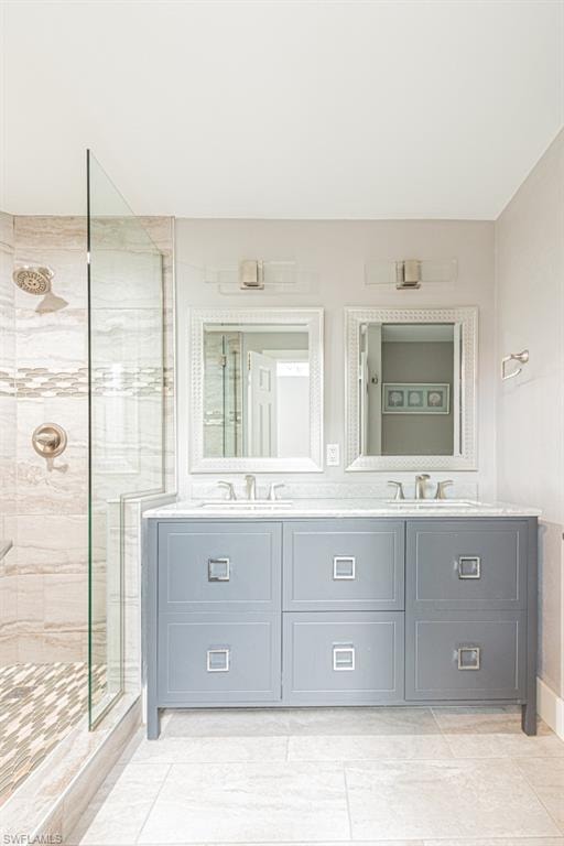 Full bathroom with a shower stall, double vanity, and light tile patterned floors