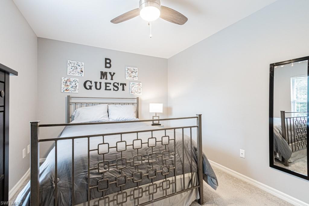 Bedroom featuring carpet and a ceiling fan