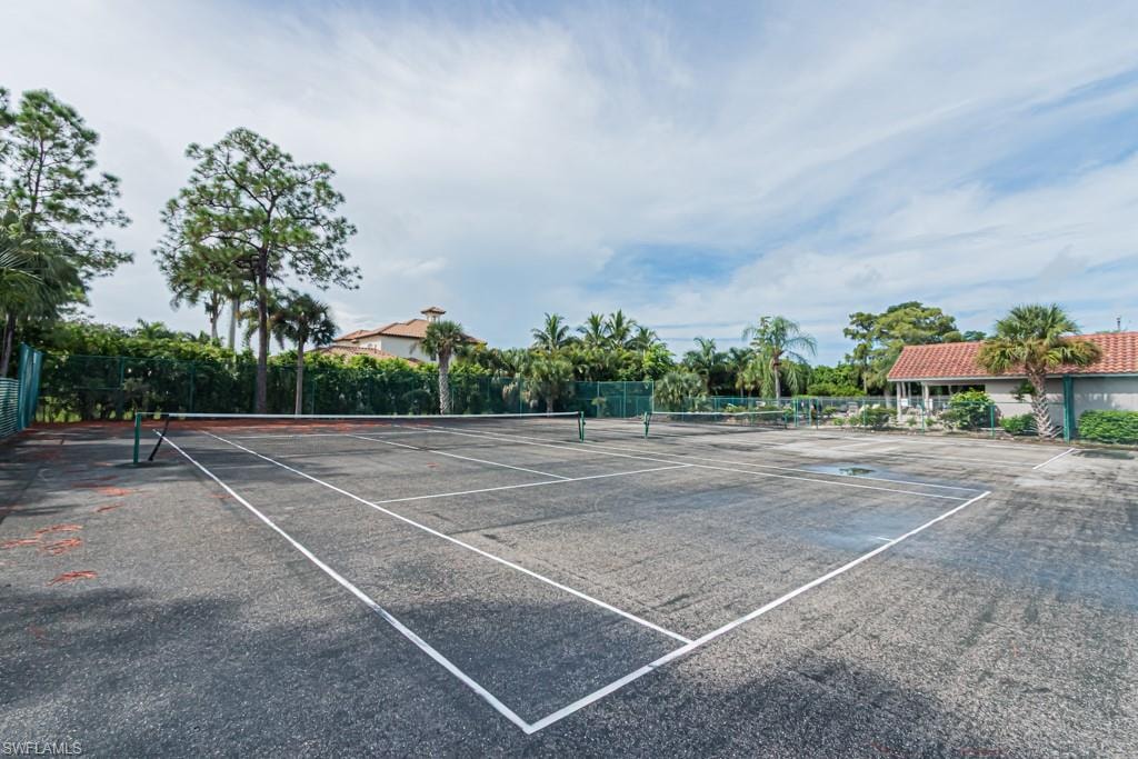 View of tennis court with community basketball court