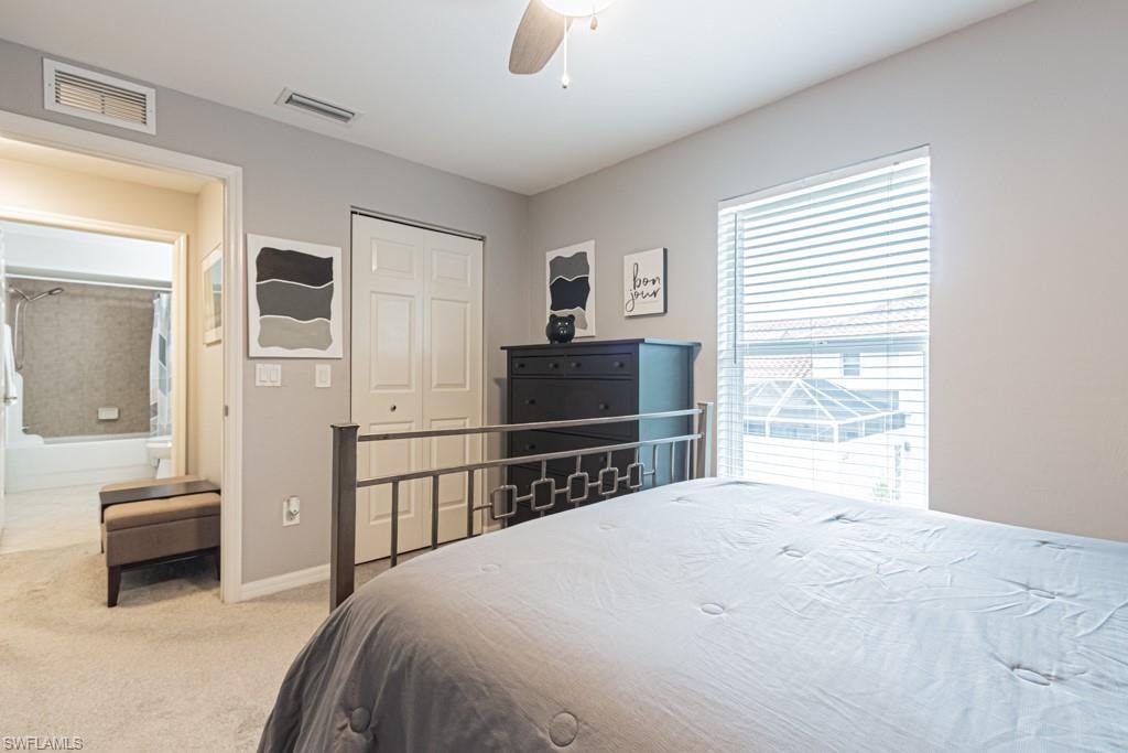 Bedroom featuring carpet floors, ceiling fan, and a closet