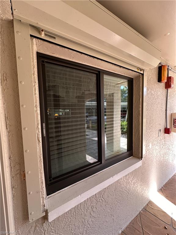 Entrance to property, impact window and shutter