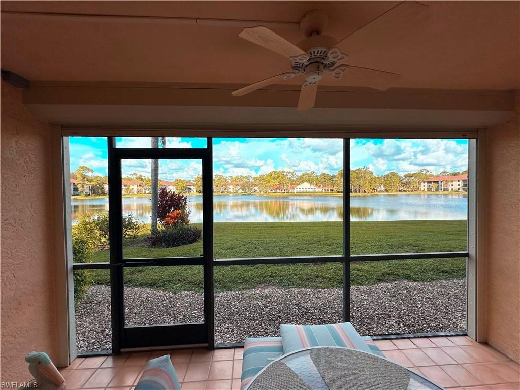 Sunroom with a water view, a ceiling fan, and plenty of natural light