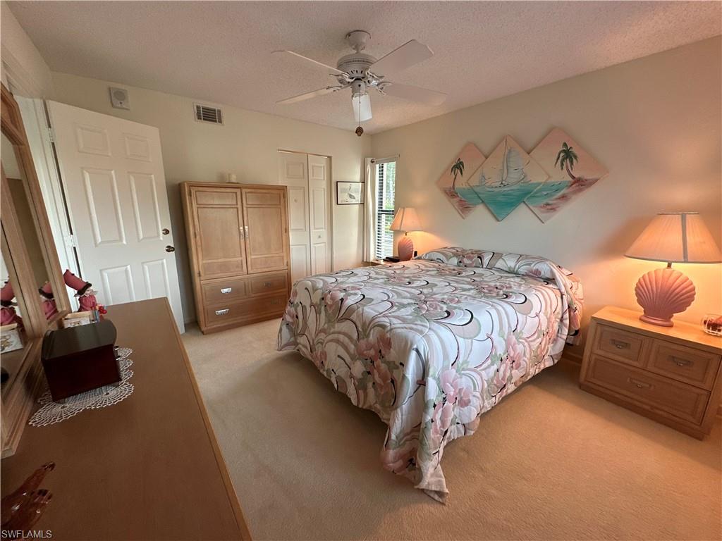 Bedroom featuring entrance to walk in closet and en suite