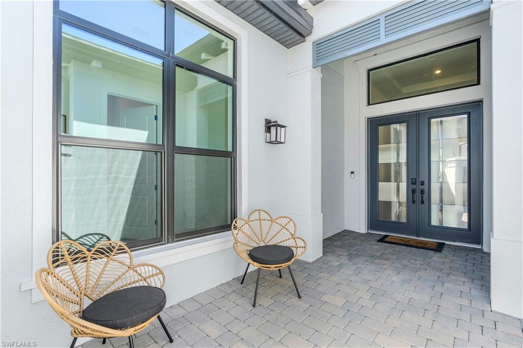 View of exterior entry with a patio, french doors, and stucco siding
