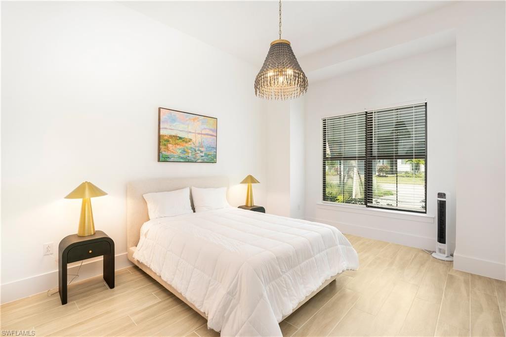 Bedroom featuring light wood finished floors and baseboards
