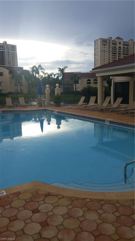 Community pool featuring a patio