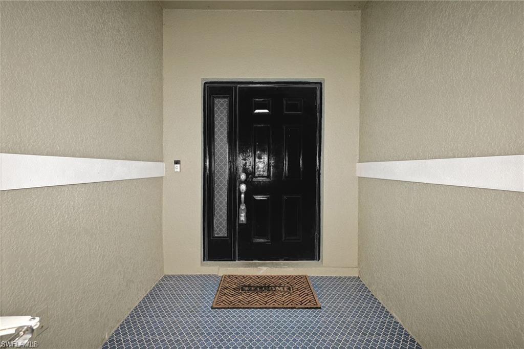 Beautiful tile on screened enclosed entrance.