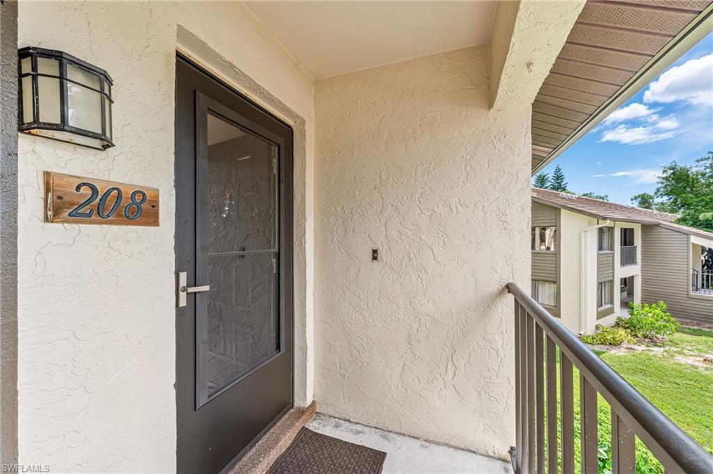 View of exterior entry with stucco siding