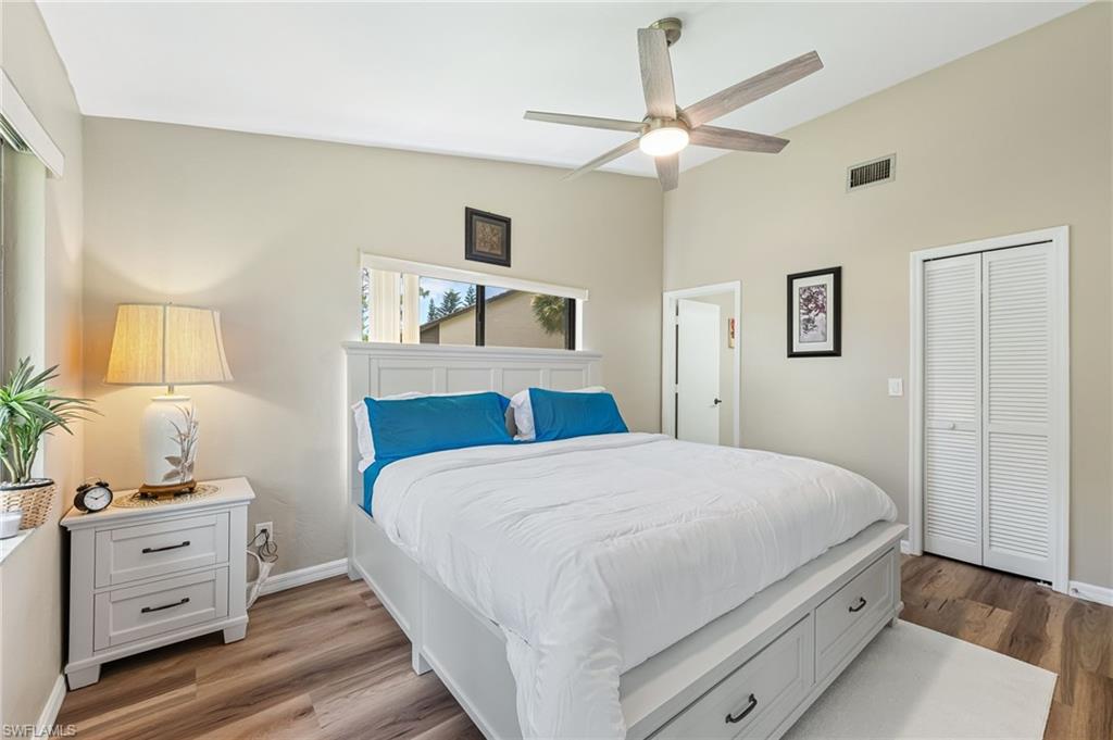 Bedroom featuring a closet, wood finished floors, and ceiling fan