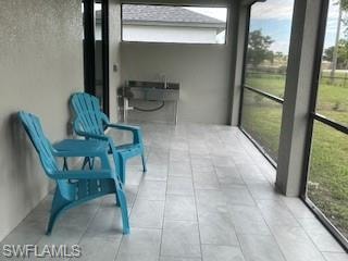 Lanai with stainless steel sink with preparation area ready for an outdoor kitchen.