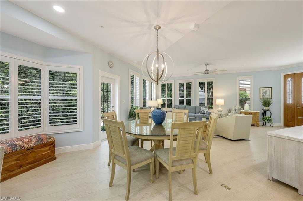 Dining room featuring a chandelier, light wood-type flooring, recessed lighting, and ceiling fan