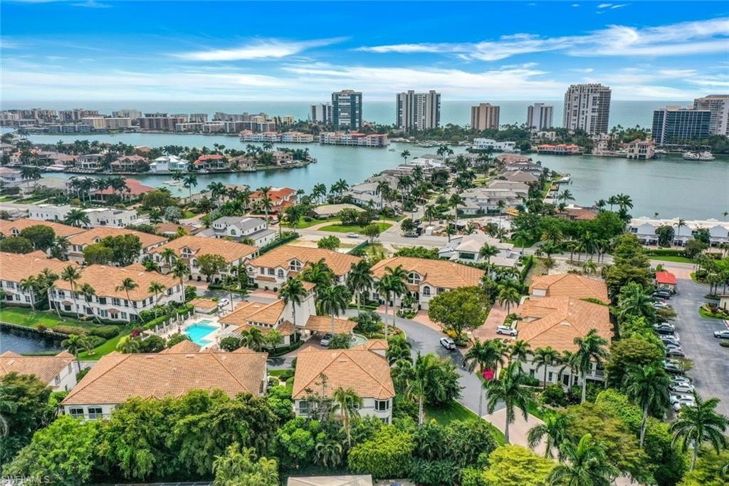 Drone / aerial view of skyline and a nearby body of water