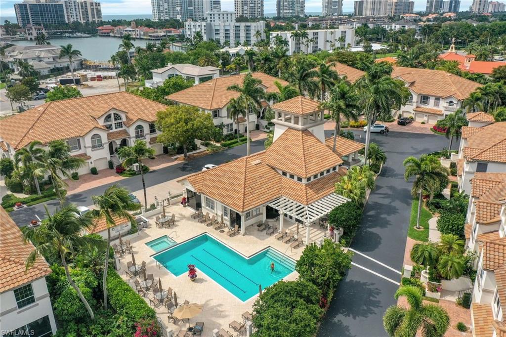 View of urban area featuring a large body of water and a pool area