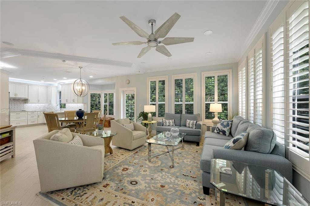 Sunroom / solarium with a chandelier