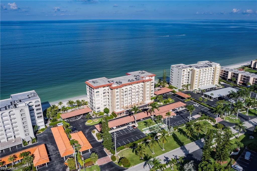 Aerial view of a large body of water and apartment complex / building