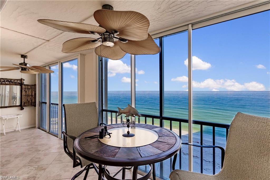 Sunroom featuring a water view and floor to ceiling windows