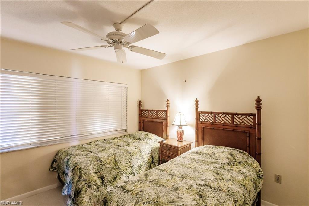 Bedroom featuring ceiling fan and baseboards