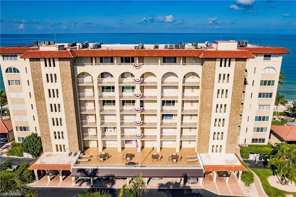 View of apartment building / complex featuring a water view