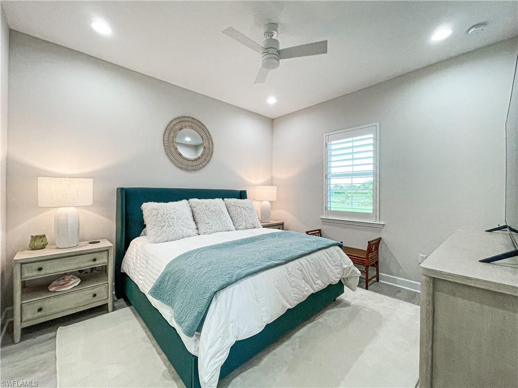 Bedroom with light wood-type flooring and ceiling fan