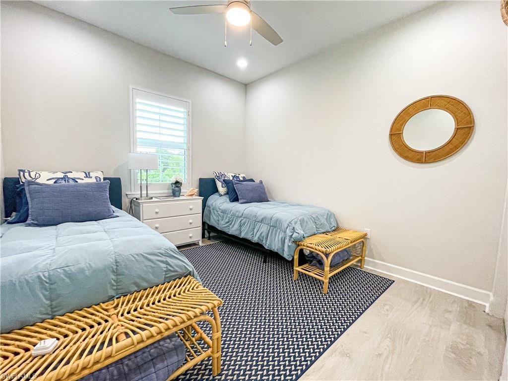 Bedroom with light wood-type flooring and ceiling fan