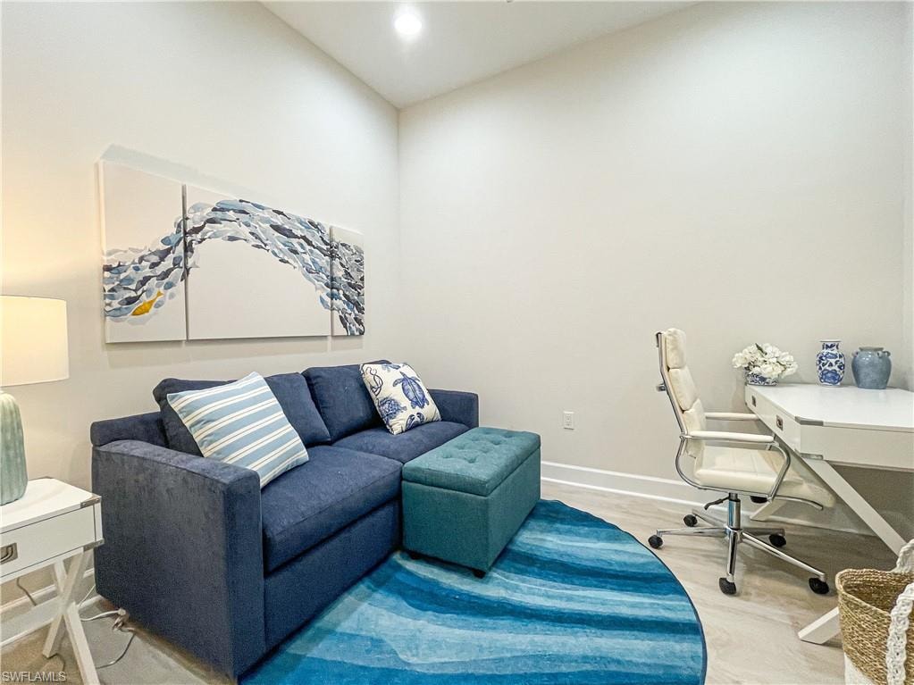 Home office with vaulted ceiling