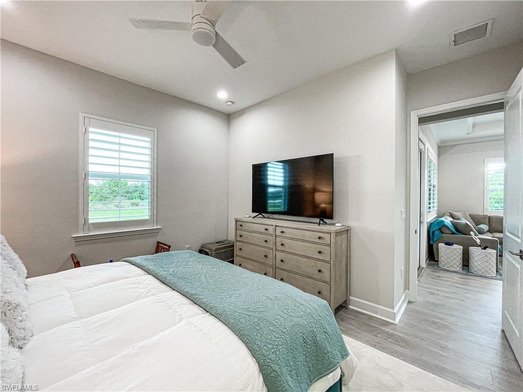 Bedroom with light wood-type flooring and ceiling fan