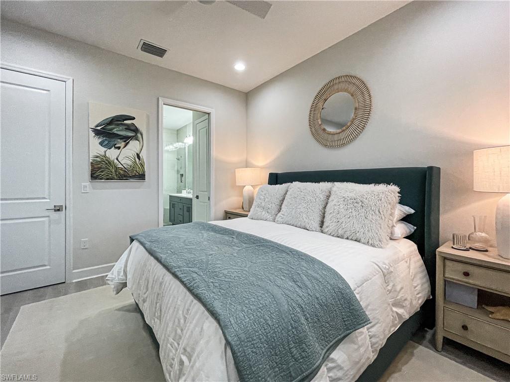 Bedroom featuring ceiling fan and connected bathroom